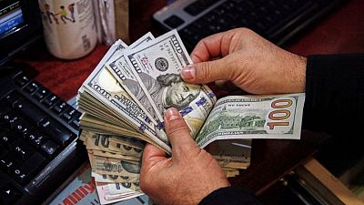 Dollar out of favour as Omicron leaves currency markets unseasonably volatile