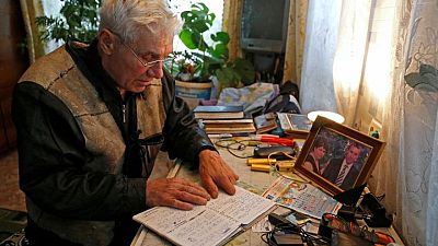 An old man keeps a chronicle of war in Ukraine's separatist Donbass