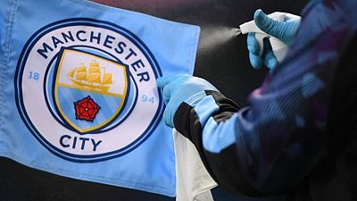 Soccer-Full steam ahead for Man City as festive fixtures survive