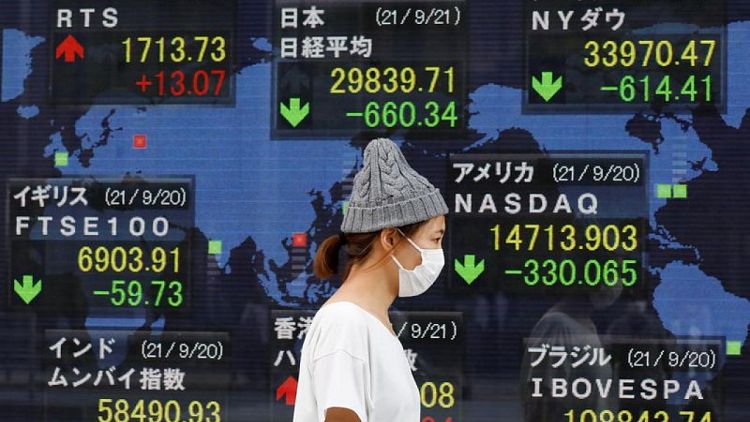 Asian shares rise, yen slides as traders shrug off Omicron fears and buy risk