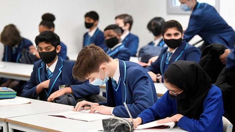English school children to wear masks to tackle Omicron surge