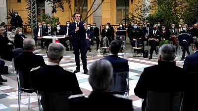 Macron promises more police on streets as rivals criticise him on security Macron promises more police on streets as rivals criticise him on security
