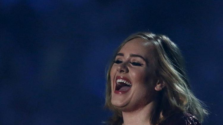 Tearful Adele postpones Las Vegas shows due to COVID delays