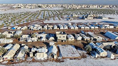 Storm blankets Syrian tented camps in snow, at least one child dead