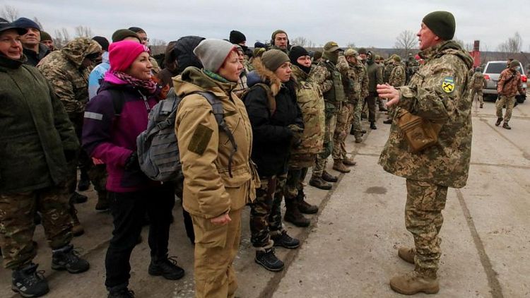 Residents of Ukrainian city near Russian border brace for the unknown