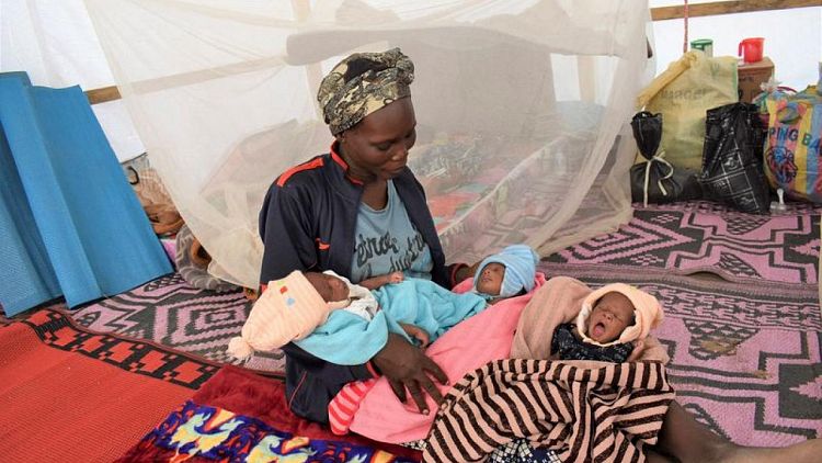 After narrow escape from violence, Cameroon refugee gives birth to triplets