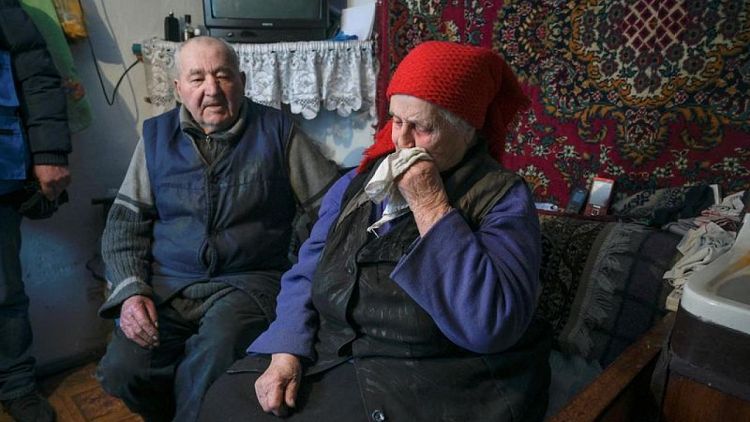 Elderly Ukrainian couple left behind in bombed out eastern village