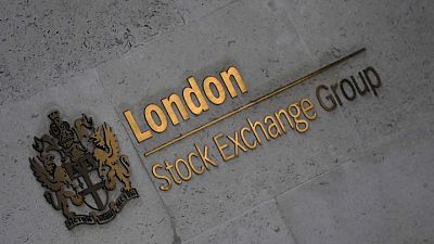 BRITAIN-STOCKS:FTSE 100 flat as investors await rate decisions; Sainsbury's jumps 