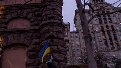 'We fear no one:' Ukrainians raise flags to defy Russia invasion fear