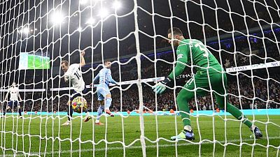 Soccer-Title race alive as City lose to Spurs and Liverpool beat Norwich
