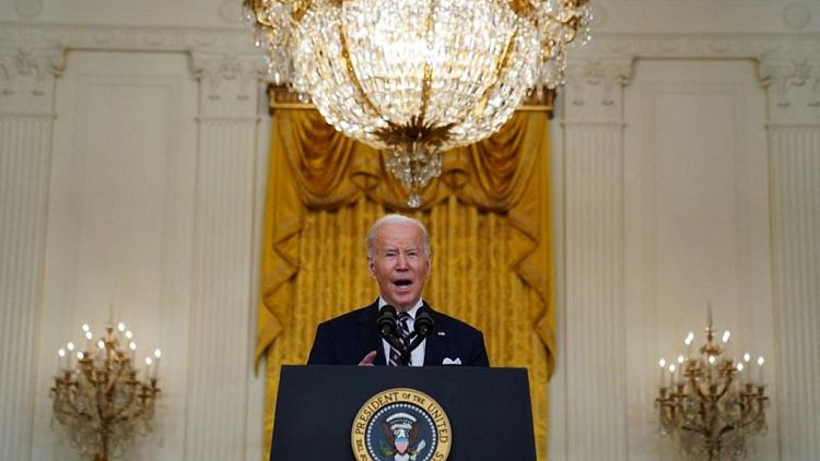 Biden announces first tranche of Russia sanctions, targets banks and debt