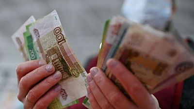 Russian rouble tumbles to record low