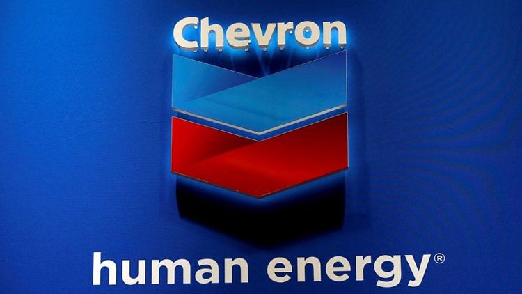 Chevron posts record profit, lifts buyback guidance