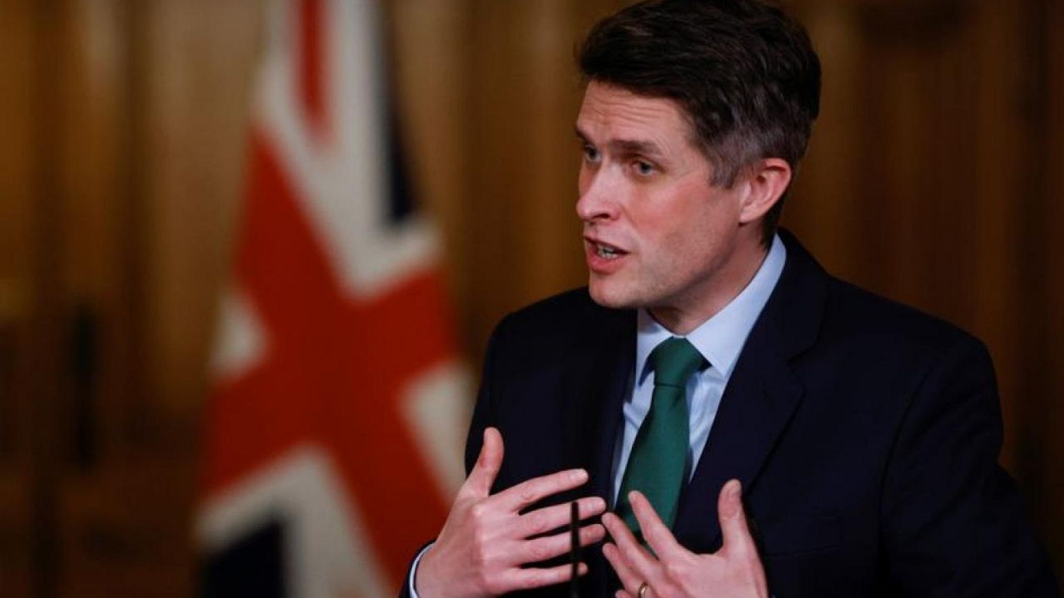UK awards knighthood to minister who was fired over security leak