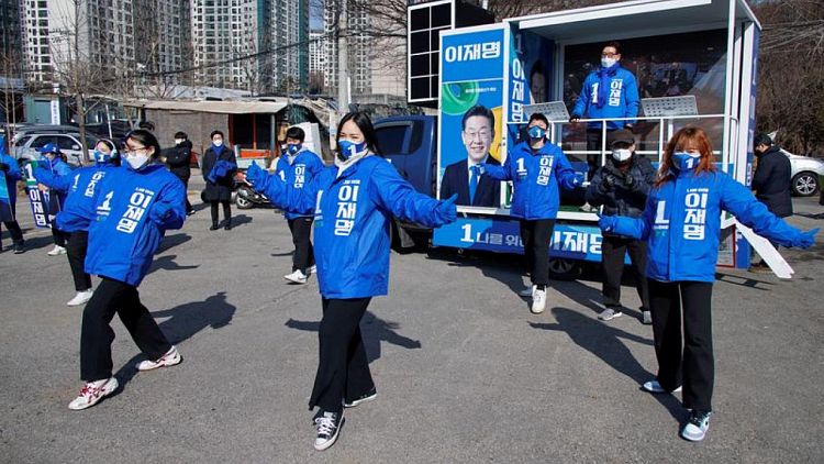 S.Korea candidates woo young voters with 'deepfakes,' hair insurance