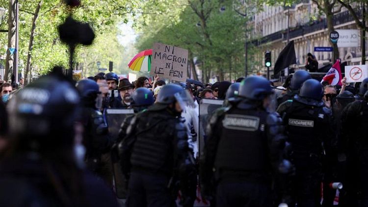 French police fire tear gas as anti far-right protesters march in Paris