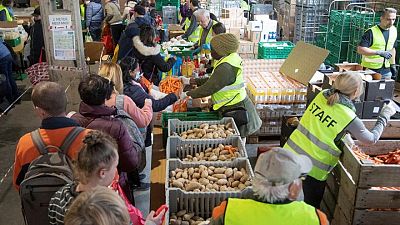 Ukrainian refugees queue for food in wealthy Switzerland