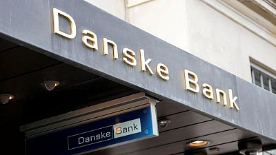 Danske warns of potential fine over Estonia case, axes dividend