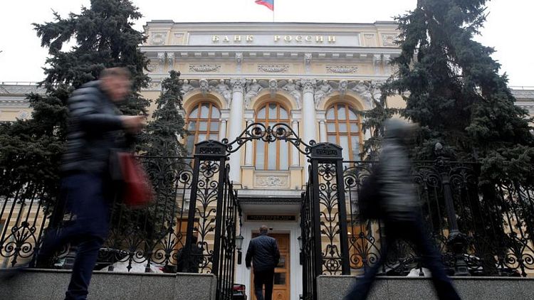 Russian central bank lowers key rate to 14%, flags more cuts