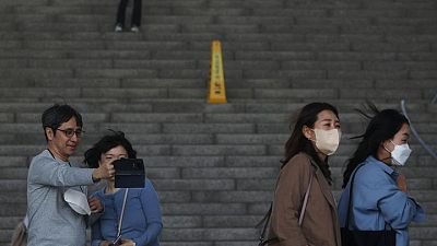 South Korea drops outdoor mask rule but many prefer to keep them on
