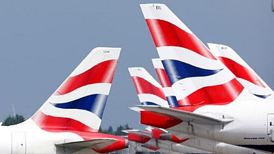 Economy worries drag FTSE 100 lower, British Airways owner slides