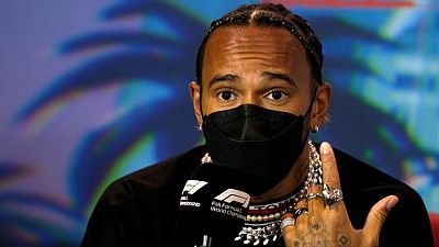 Motor racing-Hamilton gets two race exemption from jewellery rule