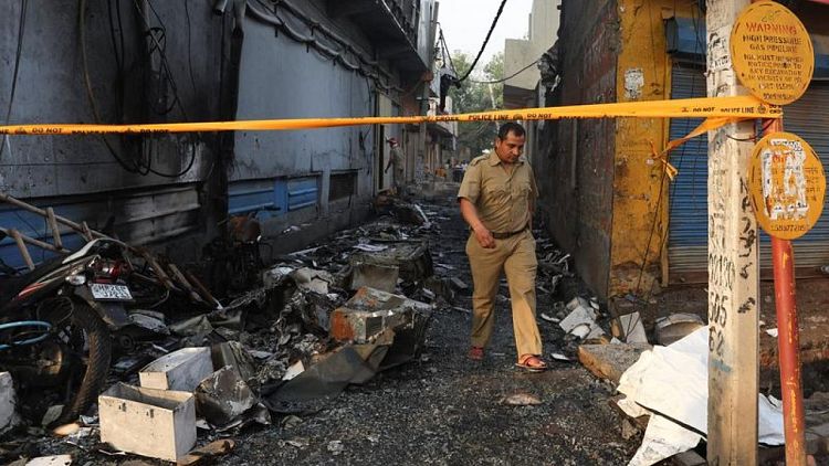 Building fire kills 27 in New Delhi, police arrest company owners
