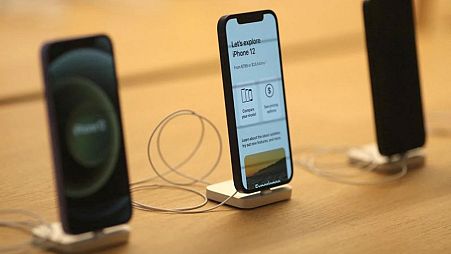 FILE PHOTO: IPhone 12 phones are seen at the new Apple Store on Broadway in downtown Los Angeles, California, U.S., June 24, 2021. 