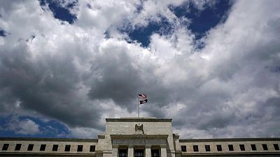 Fed officials promise rate hikes, push back on recession fears