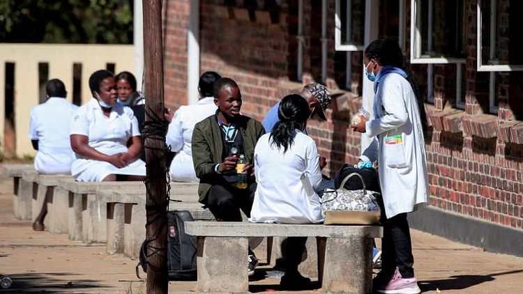 Zimbabwe healthcare workers temporarily call off wage strike