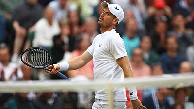 Tennis-Isner hails Murray after ending his Wimbledon hopes