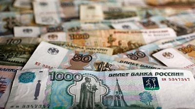 Russian rouble rises; Gazprom shares plummet on no-dividends move