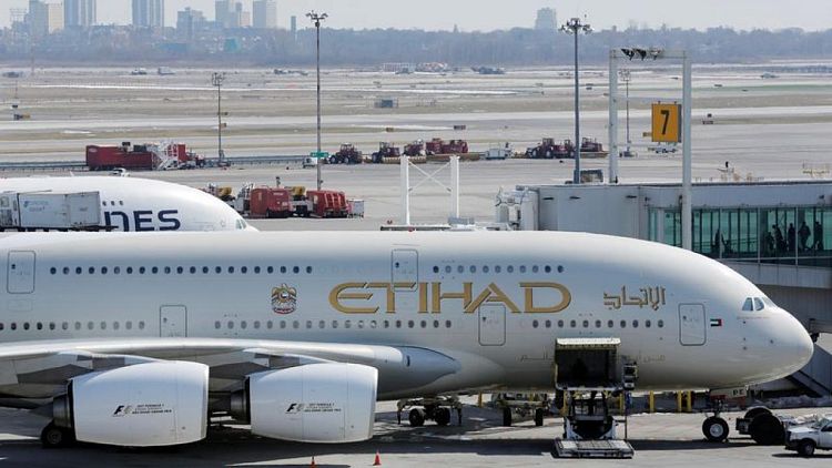 أبوظبي تنقل ملكية الاتحاد للطيران إلى شركة القابضة
