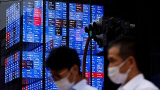 Asia shares mixed as China cuts rates, data disappoints