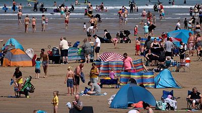 Fans, hoses and air con - heatwave-hit Britons seek relief