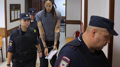 In handcuffs and led away, Griner says: 'I love my family'