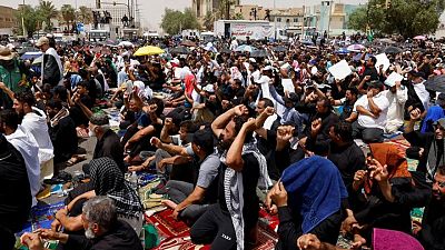 Sadr followers hold mass prayer outside Iraqi parliament in show of force