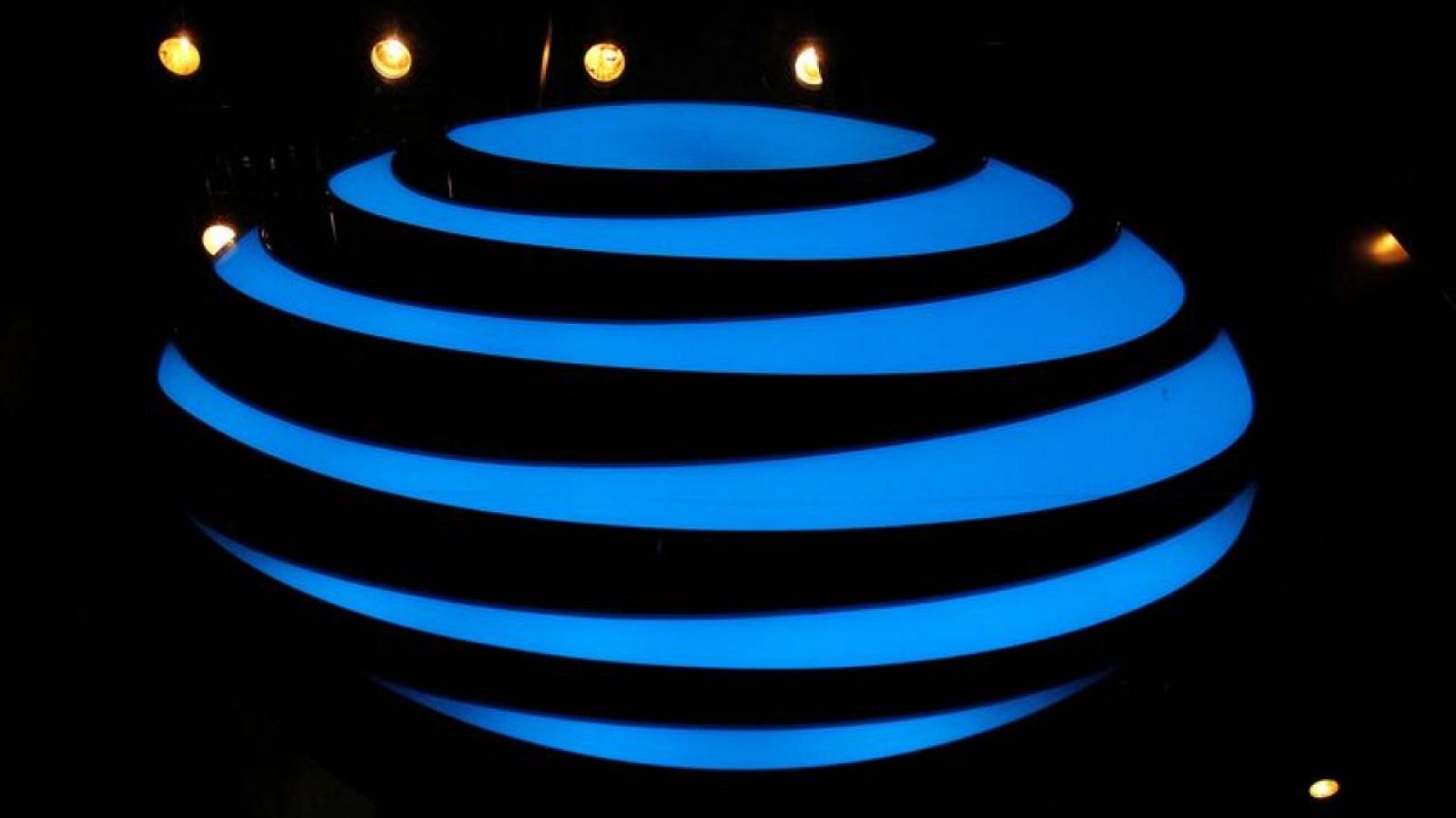 AT&T beats wireless subscriber estimates; earnings hit by $25 billion charge