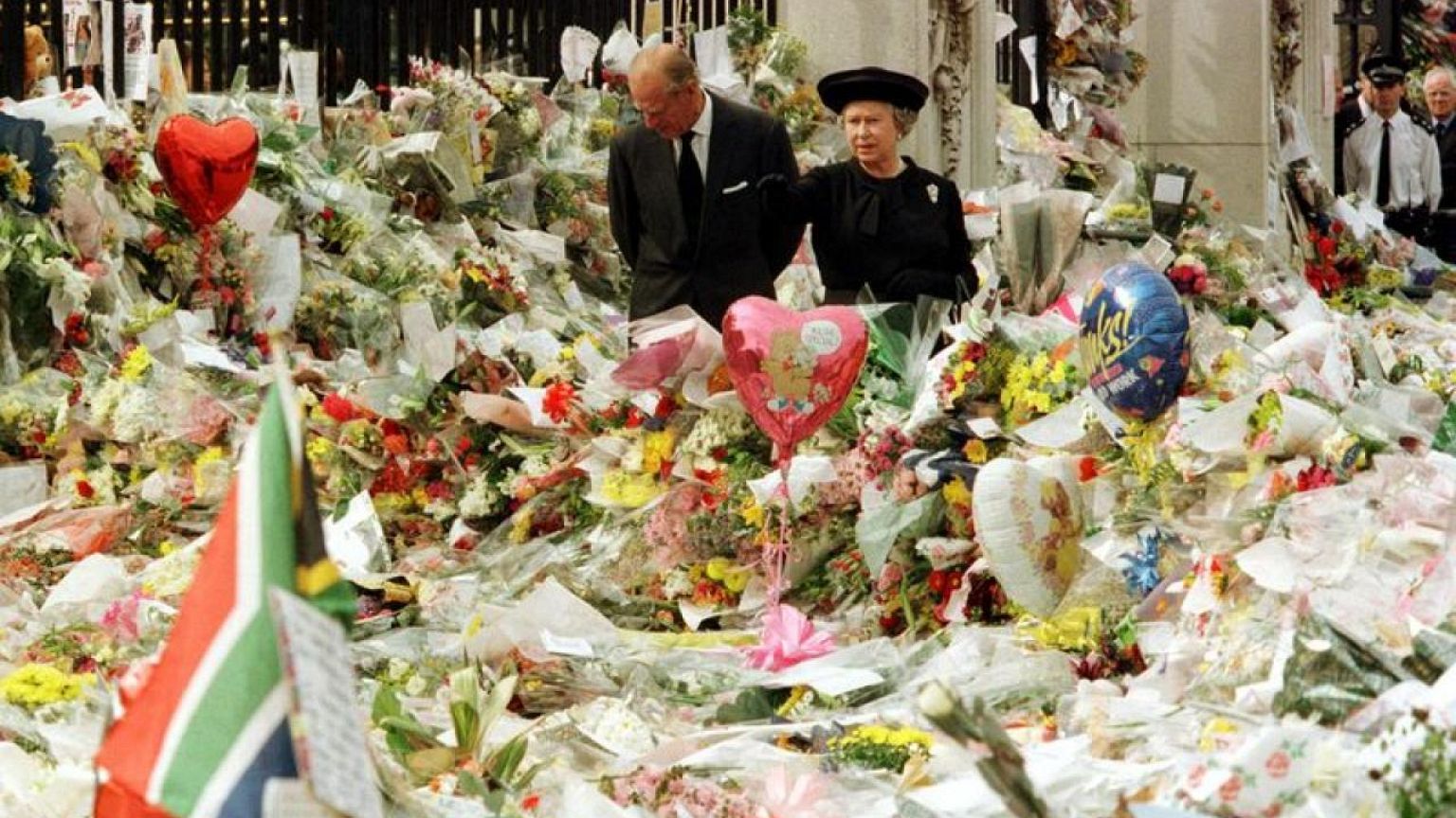 Stung by criticism over Diana, Britain's royals show common touch