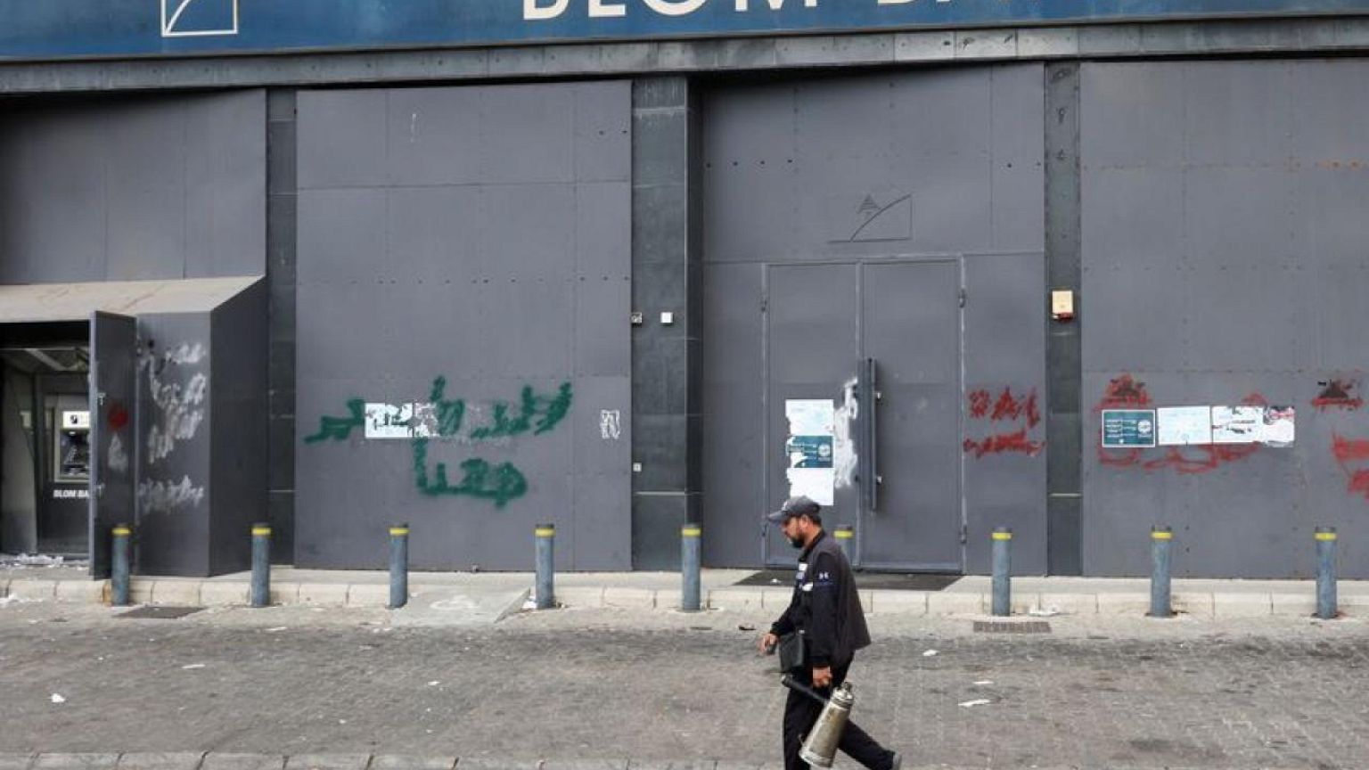On the run, Lebanese woman who stole own savings says she's not the criminal