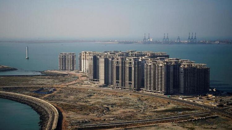 Reguladores chinos piden más apoyo financiero para las empresas inmobiliarias: fuentes