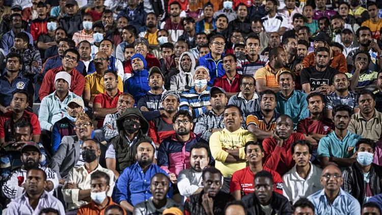 في ملعب مخصص لهم.. عمال مهاجرون يقولون إن كأس العالم نتاج عرقهم