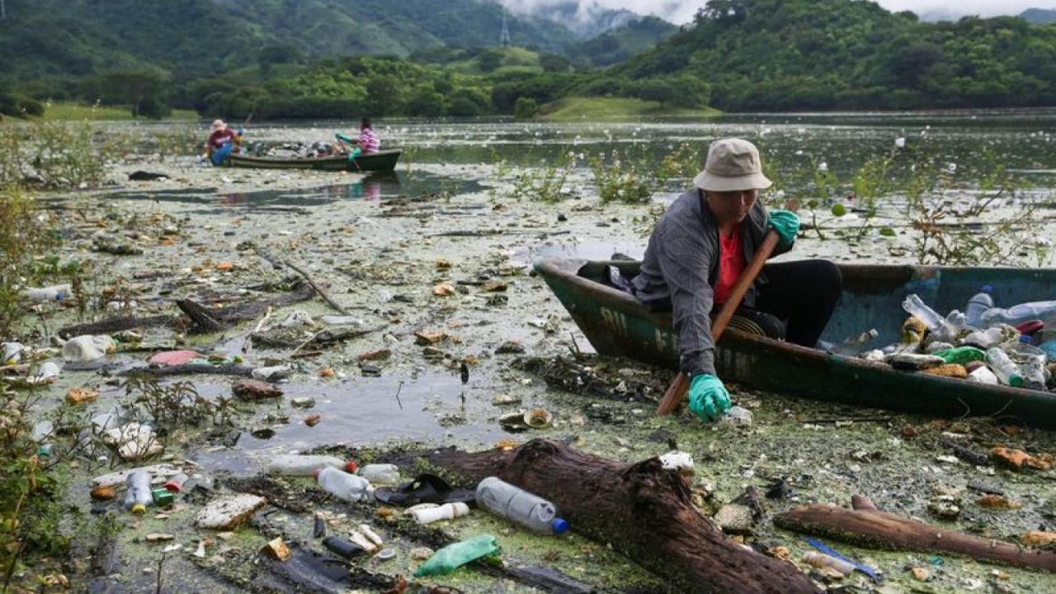 No place for flowers: El Salvador's biggest lake swamped by trash