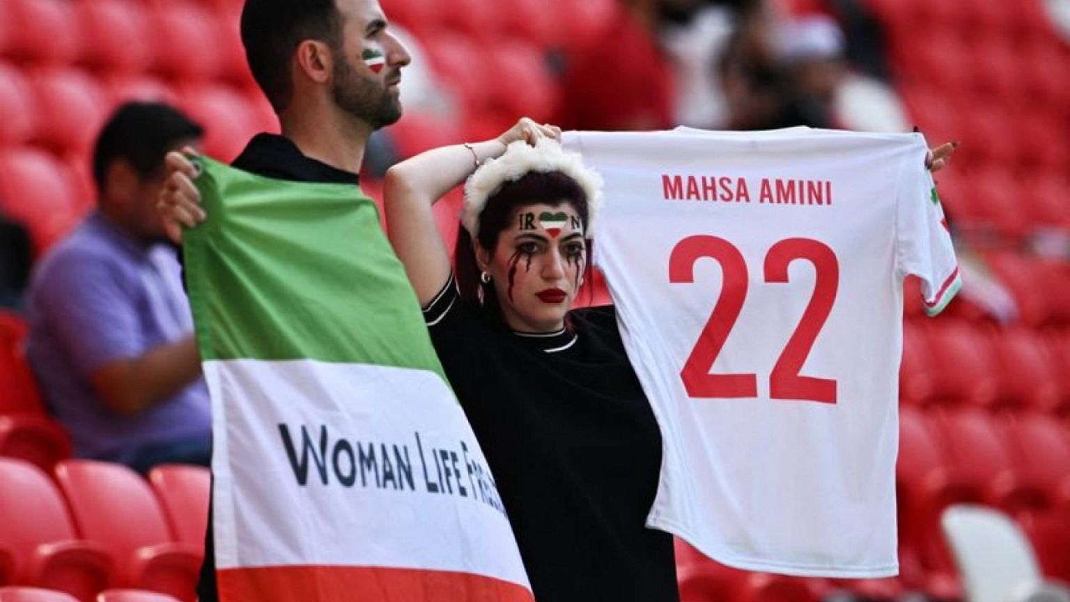 Security escort man wearing pro-Iran protest shirt ahead of match