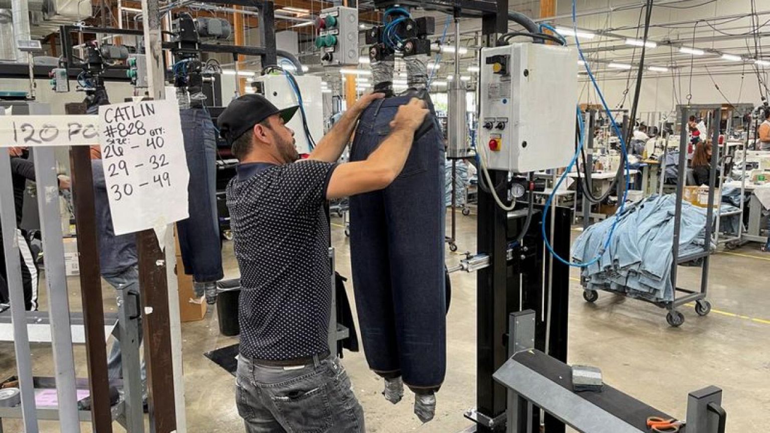 Robots set their sights on a new job: sewing blue jeans