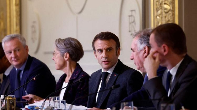 France's Macron delays divisive pension reform plans until January