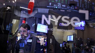 Stocks, bonds extend rally on hopes rate hikes ease