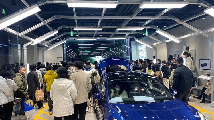 Tesla owners in China protest against surprise price cuts they missed