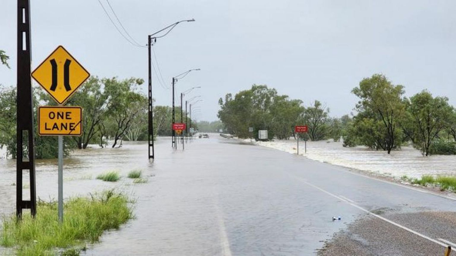 'Once in a century' flood cuts off communities in northwestern Australia