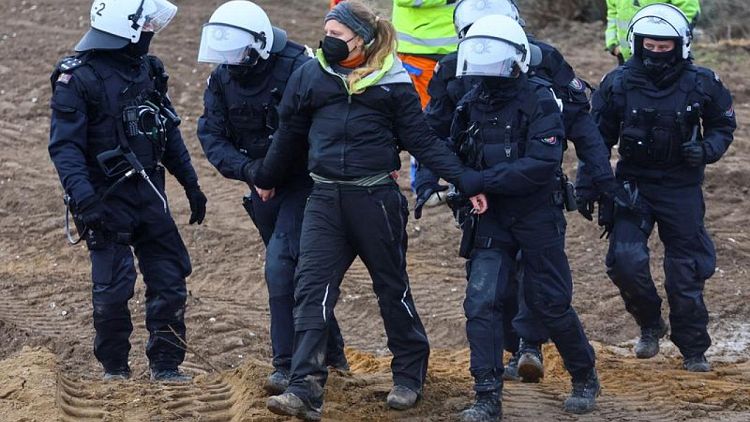 German police drag away activists protesting coal mine expansion